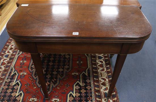 A George III mahogany folding top tea or card table, W.91cm